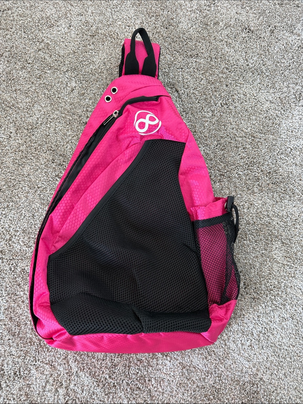 Bright Pink Sling Backpack with Black Mesh Pocket